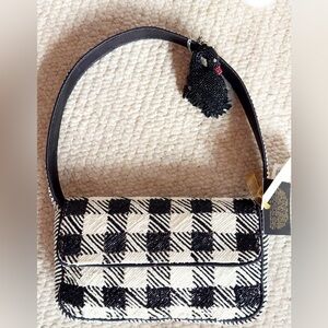 from India to YOU! Hand beaded houndstooth shoulder bag with black swan charm.